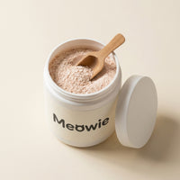 Open tub of Meowie with a wooden scoop