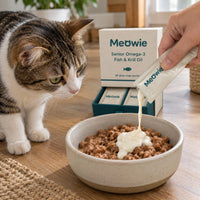 Snap-pack squeezed onto cat food